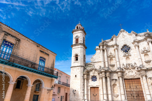 Wallpaper Mural The Havana Cathedral, a stunning baroque church in Old Havana, Cuba, stands beside colonial buildings with arched balconies under a bright blue sky.   Torontodigital.ca