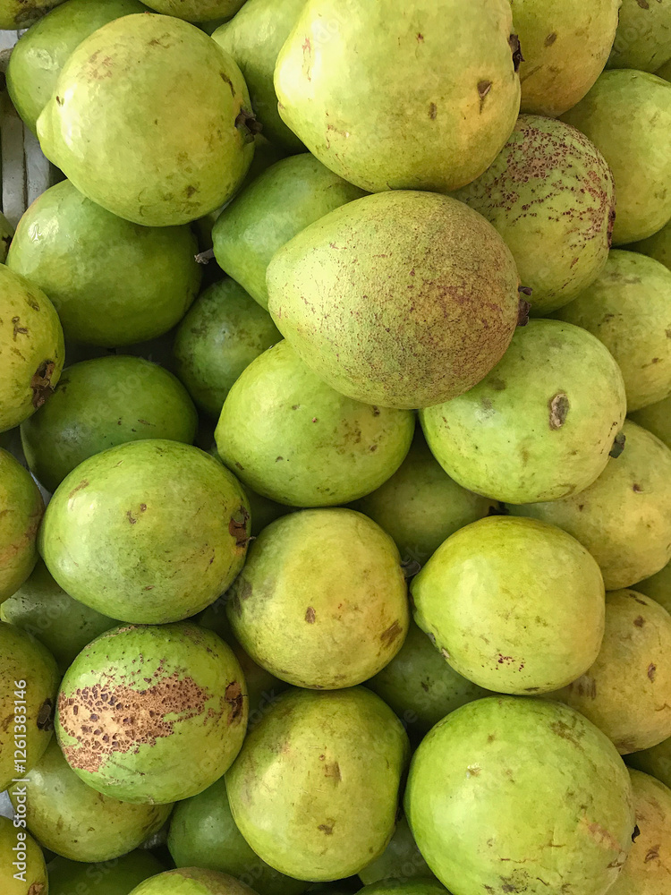 Close-up of fresh white guavas, highlighting their natural texture and greenish tones. Ideal for food campaigns, tropical products, and health & wellness content. Close-up of fresh white guavas, highlighting their natural texture and greenish tones. Ideal for food campaigns, tropical products, and health & wellness content.