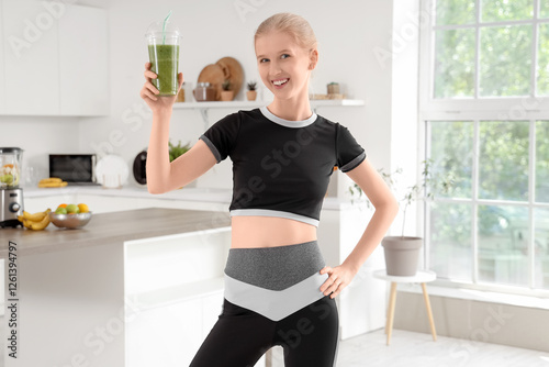 Happy sporty young woman wi...