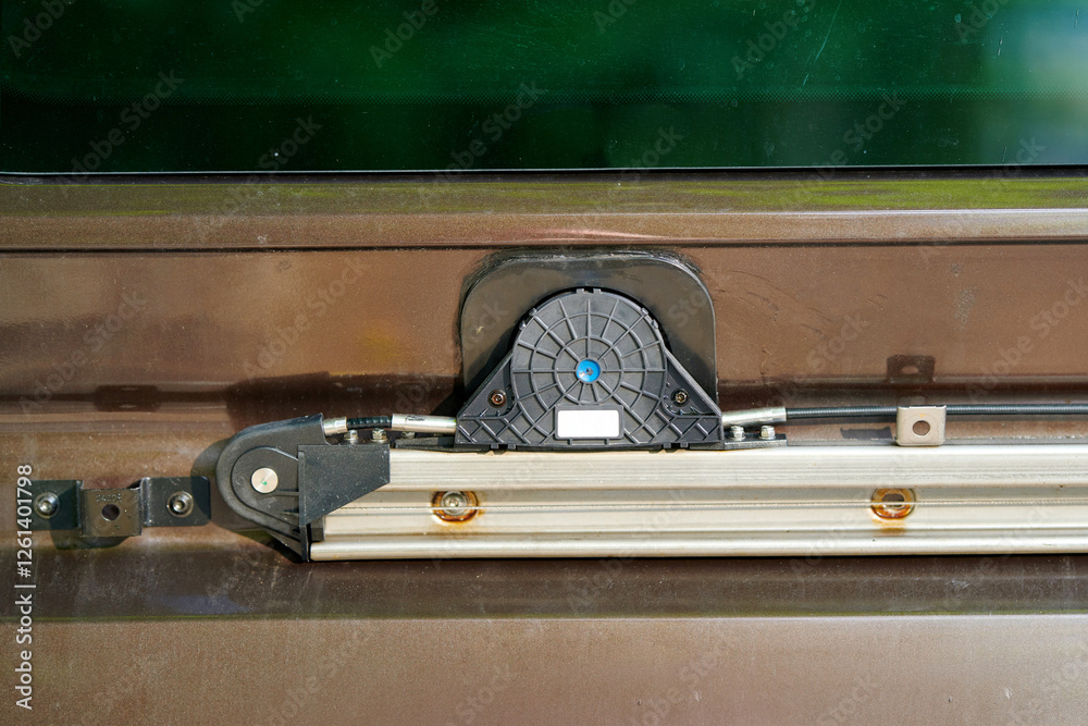 Car side sliding door mechanism. Automotive electric sliding door system with sturdy metal track and plastic roller, ensuring smooth operation, stability, and secure fastening for vehicles
