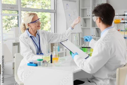 Female chemist working with...