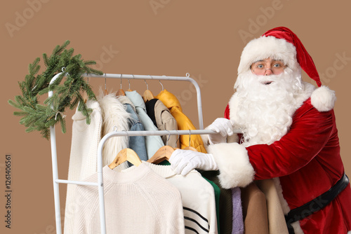 Santa Claus near rack with ...