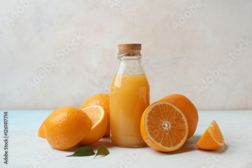 Oranges with glass bottle o...