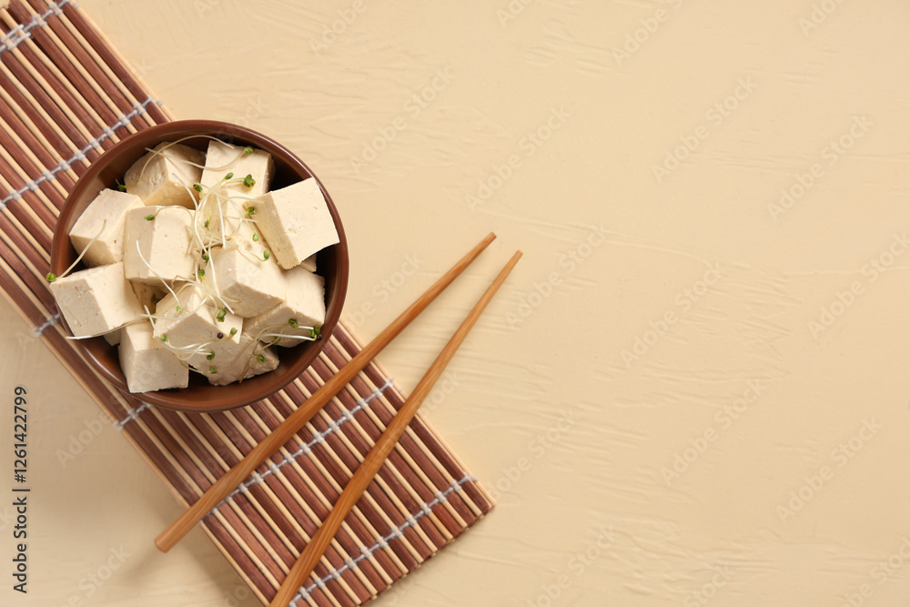 Bowl with tasty tofu cheese on beige background with space for text Bowl with tasty tofu cheese on beige background with space for text
