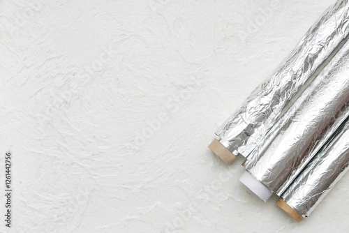 Three rolls of shiny alumin...