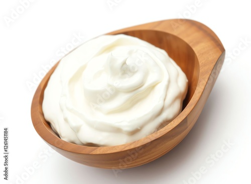 an image of a wooden spoon filled with whipped cream, there is a wooden spoon with whipped cream in it photo