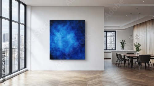A modern interior featuring a blue abstract painting on a wall.