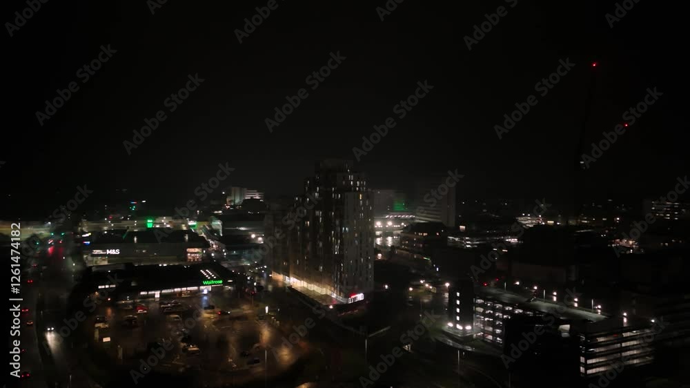 Night aerial view of illuminated city with blinking red light