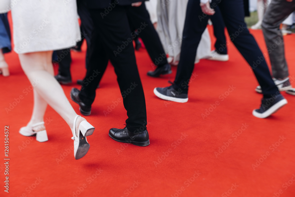 Red carpet with ropes and golden barriers on a luxury party entrance, cinema premiere tv film festival event award gala ceremony, wealthy rich guests arriving, outdoor decoration elements, summer day Red carpet with ropes and golden barriers on a luxury party entrance, cinema premiere tv film festival event award gala ceremony, wealthy rich guests arriving, outdoor decoration elements, summer day