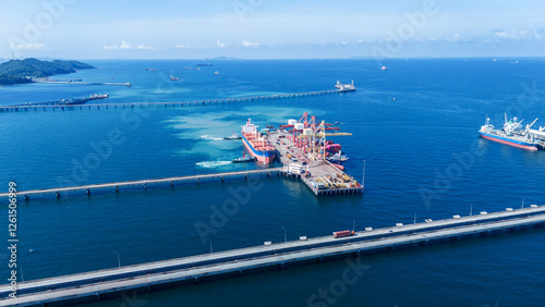 Photography Tug boat pulling Cargo container ship go to international yard port