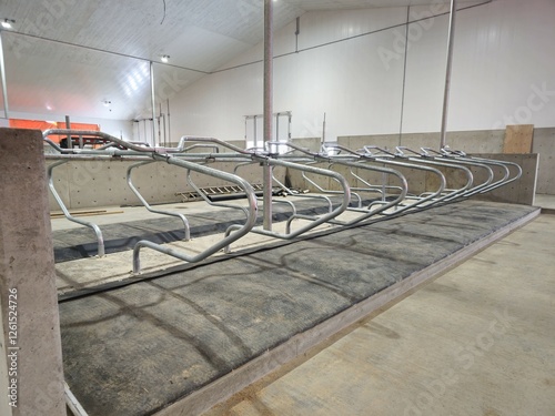 A new dairy production facility. Showing the cow loafing and resting area. Rubber mats filled with water, assures cows are comfortable.