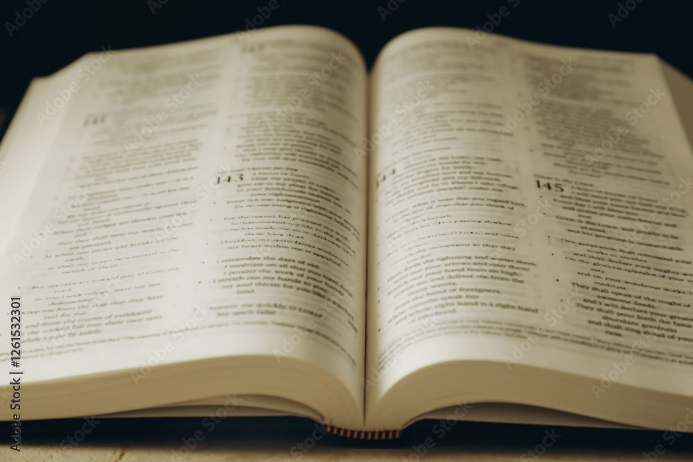 Open Holy Bible in English language on table, closeup Open Holy Bible in English language on table, closeup