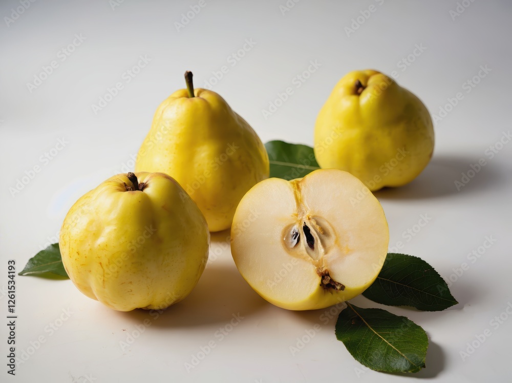 Three Yellow Quinces with One Cut in Half on White Background Three Yellow Quinces with One Cut in Half on White Background