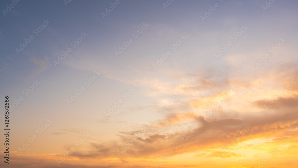 Golden sunset sky clouds in the evening sun dawn, Horizon sky background with Orange, Yellow sunlight in golden hour Golden sunset sky clouds in the evening sun dawn, Horizon sky background with Orange, Yellow sunlight in golden hour