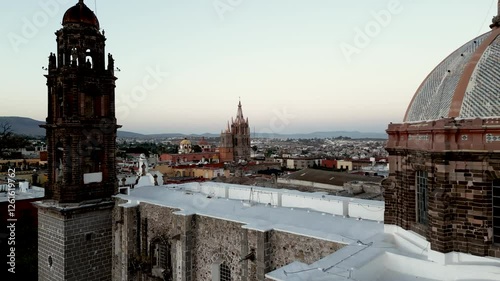 San Miguel de Allende - Gothic Church, the Parroquia de San Miguel Arcángel reveal 4k drone and aerial video at sunrise. Mexico Colonial town and pueblo magico