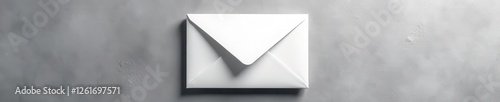 Sharp white envelope on rough gray surface Textural interplay , design, texture