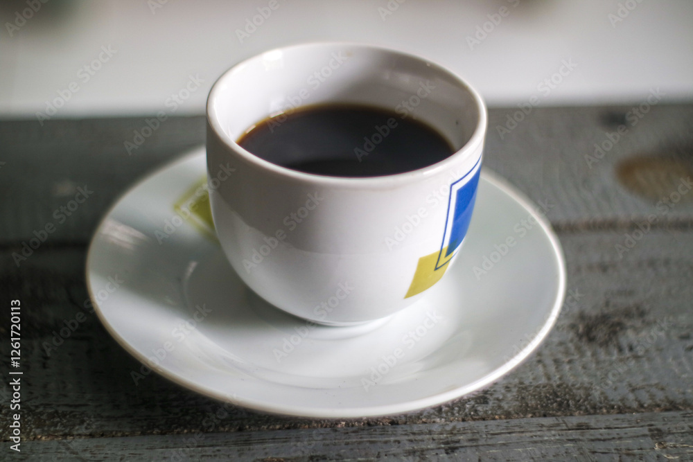 cup of coffee on wooden table cup of coffee on wooden table