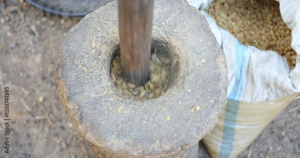 Manually grinding coffee beans is a tradition Manually grinding coffee beans is a tradition