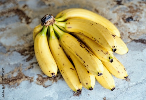 ripe fresh healthy banana cluster on stone table photo