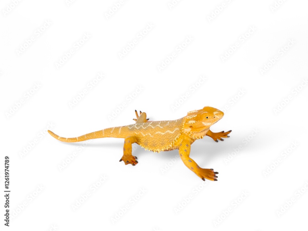 Naklejka premium Miniature dragon lizard toy with white background