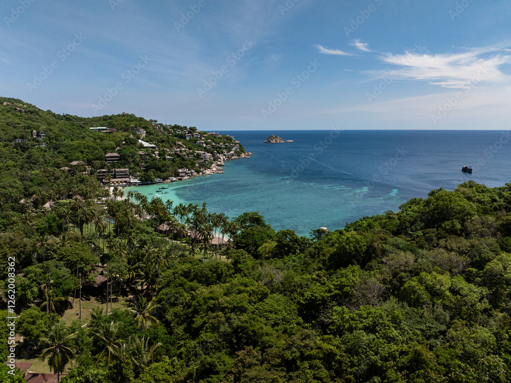 Coastal view with tropical greenery, clear turquoise water, and a calm ocean under a sunny sky. Koh Tao, Thailand. Coastal view with tropical greenery, clear turquoise water, and a calm ocean under a sunny sky. Koh Tao, Thailand.