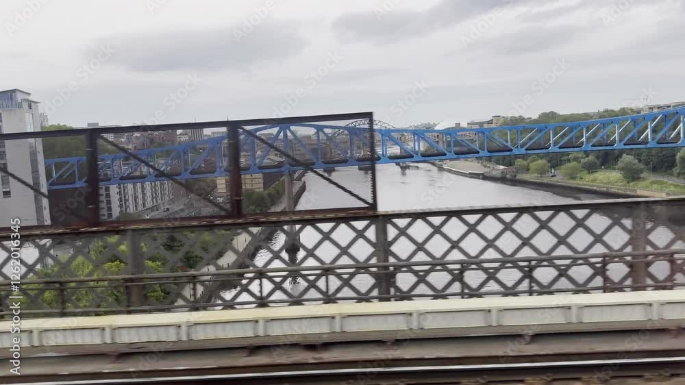 Travelling on King Edward VII Bridge with view over to Newcastle Quayside Travelling on King Edward VII Bridge with view over to Newcastle Quayside