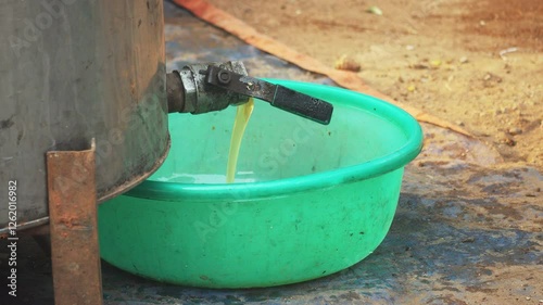 Wallpaper Mural Close-up of farmer extracting honey from large metal barrel. Bee Farm Honey Harvest. Torontodigital.ca