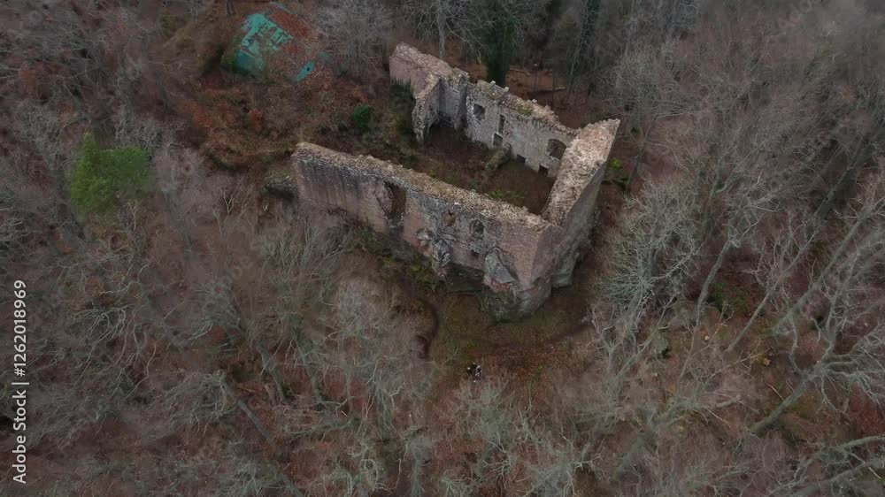 Small ruins of an old building in the middle of a forest during autumn in Orschwiller, France Small ruins of an old building in the middle of a forest during autumn in Orschwiller, France