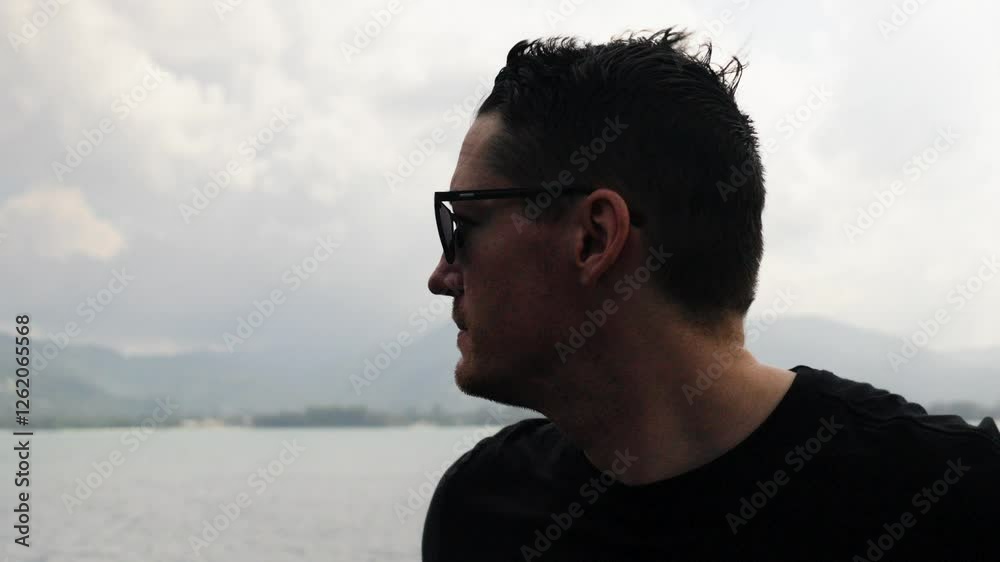 slow motion shot of a tourist standing on a ferry heading to Koi Samui in Thailand slow motion shot of a tourist standing on a ferry heading to Koi Samui in Thailand