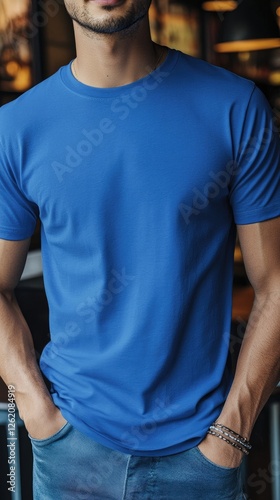 A man wearing blue color t shirt mockup; with bracelet; at the cafe; front view
