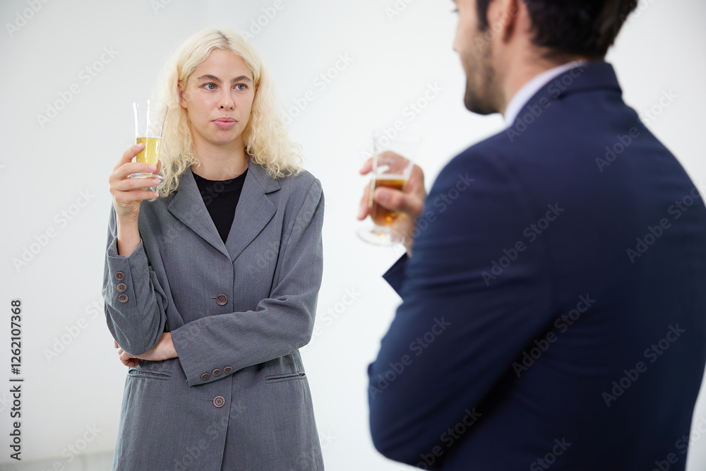 businesswoman talking with businessman and holding a glasses of beer in the office businesswoman talking with businessman and holding a glasses of beer in the office