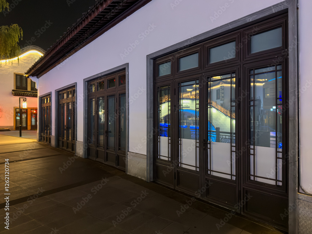 Elegant Nighttime Urban Architecture with Traditional Windows Elegant Nighttime Urban Architecture with Traditional Windows