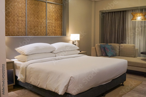 Cozy  Bedroom Interior with Soft Lighting and Elegant Bedding Setup