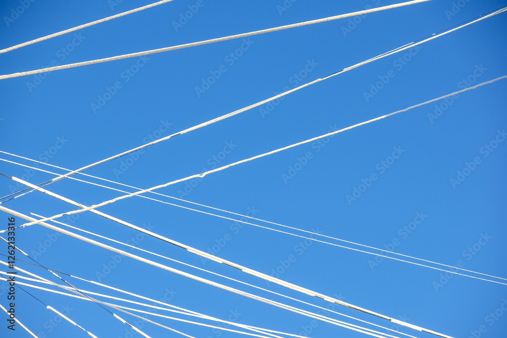 Fototapeta premium There are many aircraft tracks in the sky, forming long white lines.