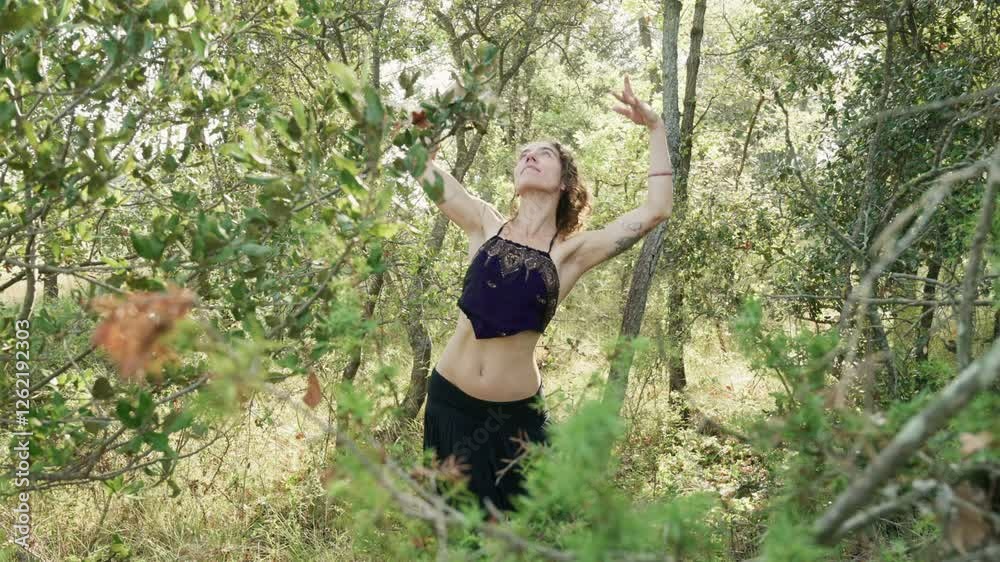 Female Tribal Dancer Performs in Nature Showcasing Cultural Expression and Movement Female Tribal Dancer Performs in Nature Showcasing Cultural Expression and Movement