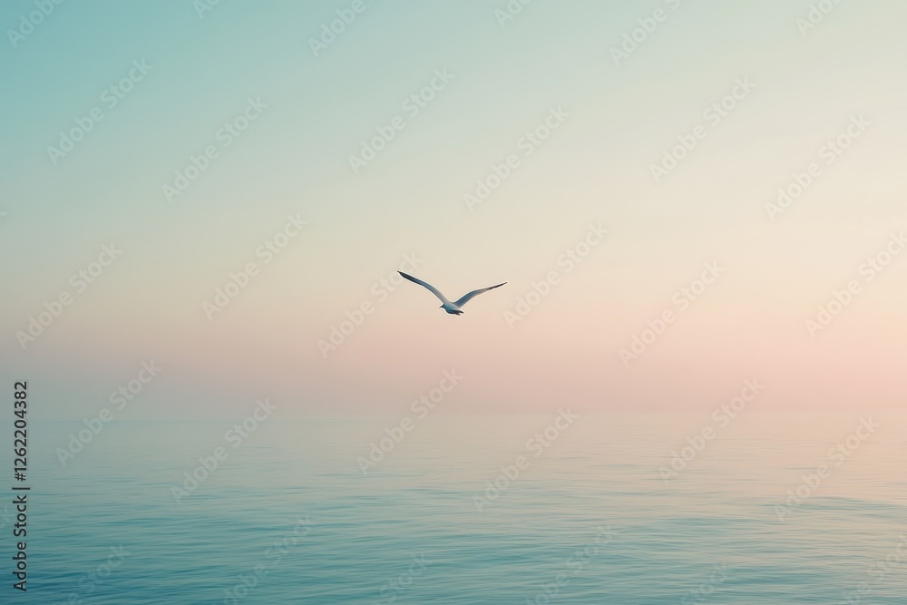 Fototapeta premium Seagull glides gracefully across a calm ocean under a pastel sky at dusk, seagull flies in a clear peaceful sky