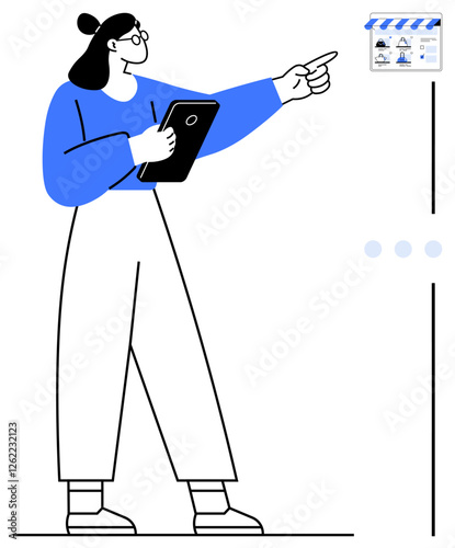 Professional woman pointing at wall calendar while holding tablet. Wearing glasses and blue shirt. Ideal for business planning, time management, project tracking, conference scheduling, task