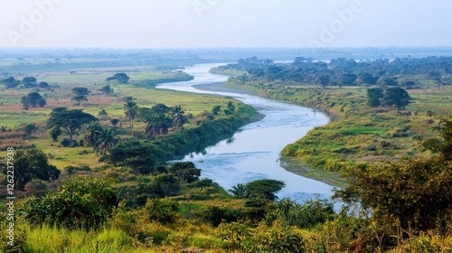 Serene river winding through agricultural landscape
