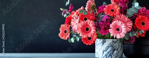 A vase of flowers sits on a table