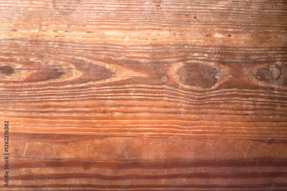 Old and dirty streak of dark brown wood plank.