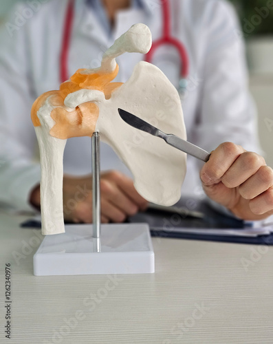 Surgeon and anatomy of shoulder and scalpel concept. Shoulder surgery and arthroscopic shoulder surgery concept photo