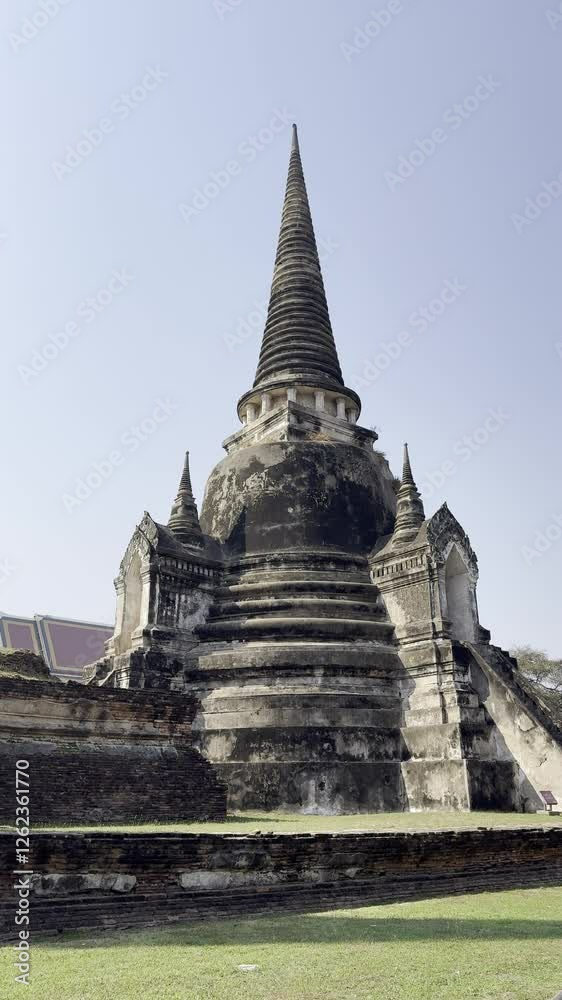 Detailed view of an ancient stupa at Wat Phra Si Sanphet in Ayutthaya, Thailand. A stunning example of Siamese architecture, standing tall under a clear sky, symbolizing the region’s rich history. Detailed view of an ancient stupa at Wat Phra Si Sanphet in Ayutthaya, Thailand. A stunning example of Siamese architecture, standing tall under a clear sky, symbolizing the region’s rich history.