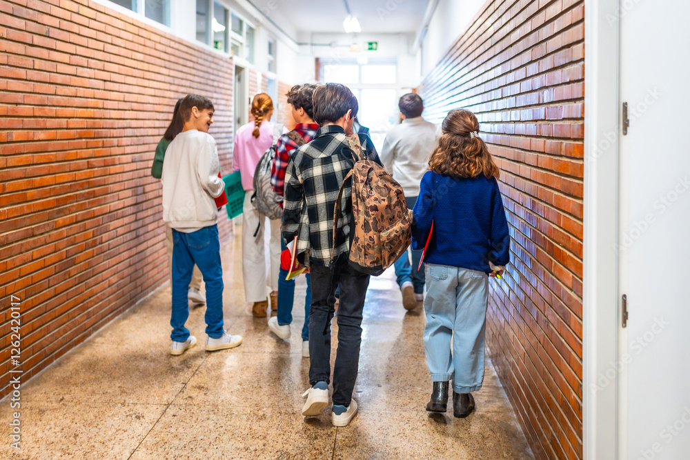 Students walking in school hallway between classes Students walking in school hallway between classes