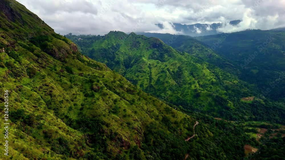 Drone aerial landscape of mountain range Kalthota highlands forest bushland vegetation with cloud haze fog at Ravana waterfalls park Ella Sri Lanka Asia nature travel tourism hiking Drone aerial landscape of mountain range Kalthota highlands forest bushland vegetation with cloud haze fog at Ravana waterfalls park Ella Sri Lanka Asia nature travel tourism hiking