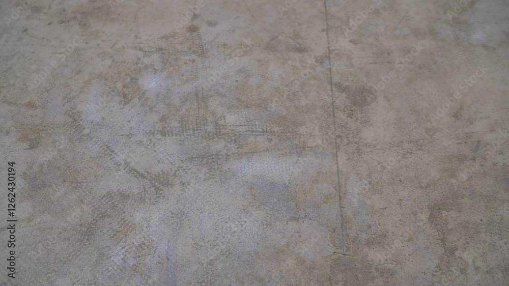 Concrete floor drying process showing subtle changes Concrete floor drying process showing subtle changes