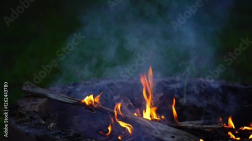 Flames in a leaf burner in a garden to make organic fertilizer from burning.