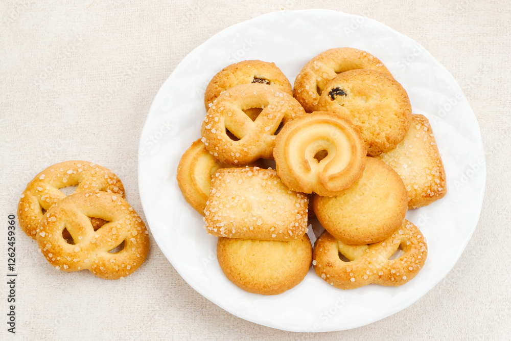 Assorted of danish butter cookies, served on a white plate.
Assorted of danish butter cookies, served on a white plate.