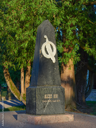 Monument on the grave of famous Finnish writer Alexis Kivi in old Lutheran cemetery in Tuusula town in Finland. photo