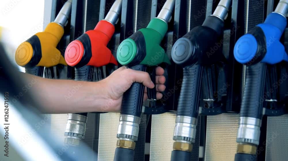 Gas station Gas pump close up. pump nozzles at gas station