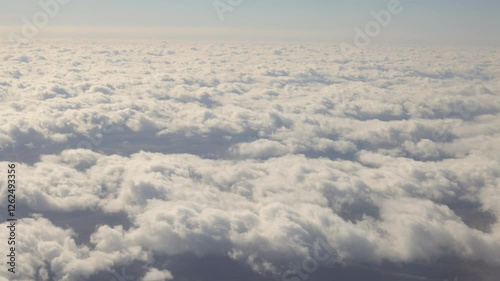 Aerial view of flight Above Clouds.
